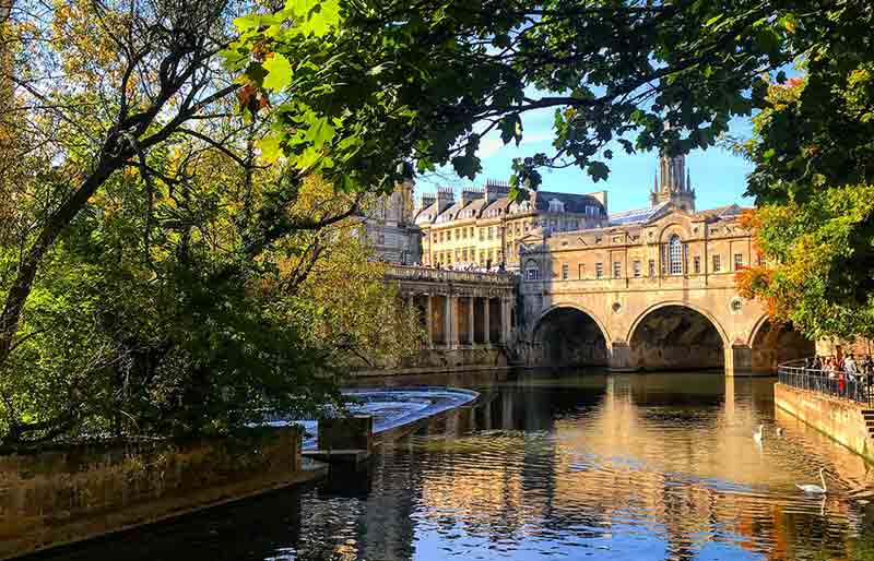 Spanning the river with arches and shops.
